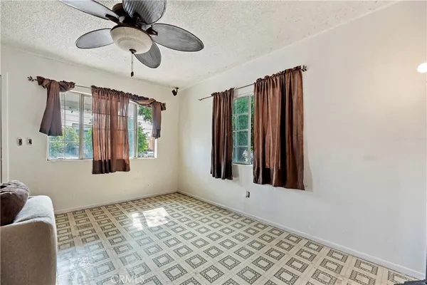 a view of a livingroom with furniture and windows
