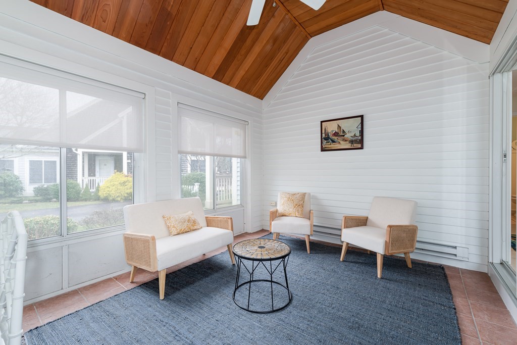 23 Gold Leaf Lane, Unit 23 Mashpee, MA 02649 - Photo 12 of 32 a living room with furniture a table and chair