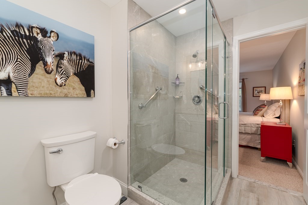 23 Gold Leaf Lane, Unit 23 Mashpee, MA 02649 - Photo 16 of 32 a bathroom with a shower and a toilet