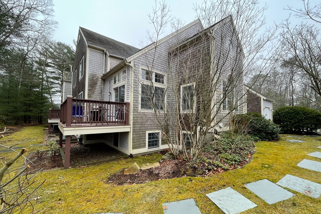 23 Gold Leaf Lane, Unit 23 Mashpee, MA 02649 - Photo 27 of 32 a view of house with swimming pool and sitting area