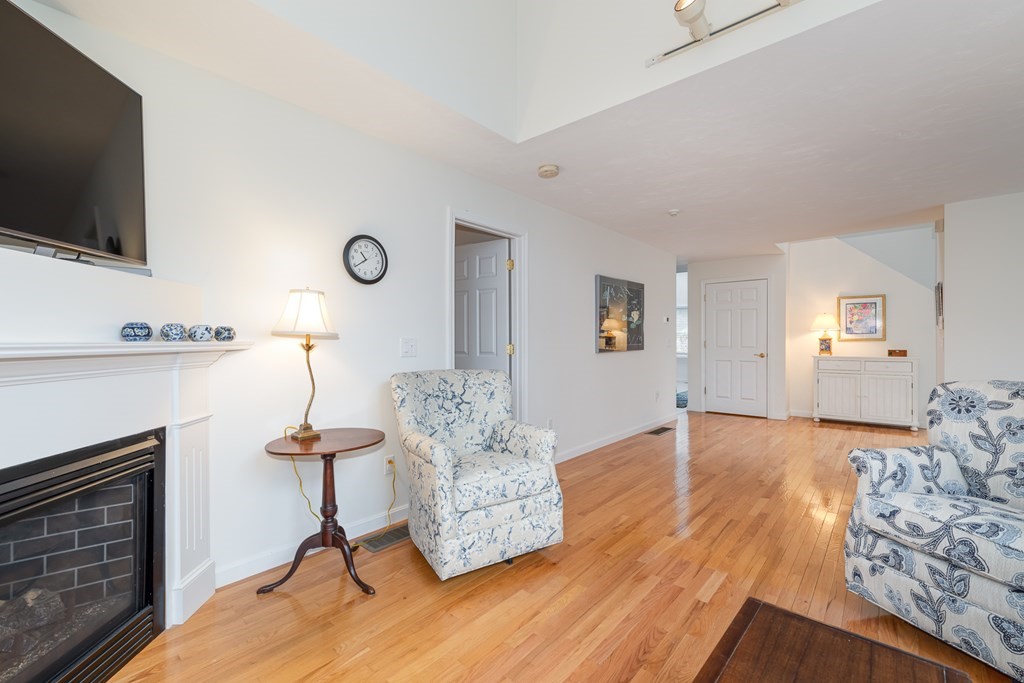 23 Gold Leaf Lane, Unit 23 Mashpee, MA 02649 - Photo 3 of 32 a living room with furniture and a flat screen tv