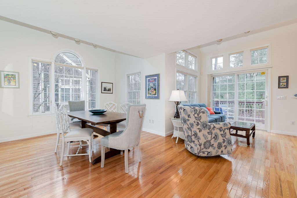 23 Gold Leaf Lane, Unit 23 Mashpee, MA 02649 - Photo 4 of 32 a living room with furniture and a wooden floor