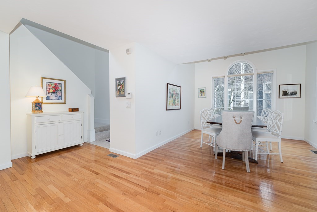 23 Gold Leaf Lane, Unit 23 Mashpee, MA 02649 - Photo 5 of 32 a view of a dining room with furniture and wooden floor