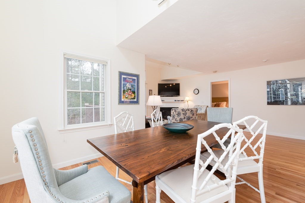 23 Gold Leaf Lane, Unit 23 Mashpee, MA 02649 - Photo 6 of 32 a work room with furniture a flat screen tv and a window