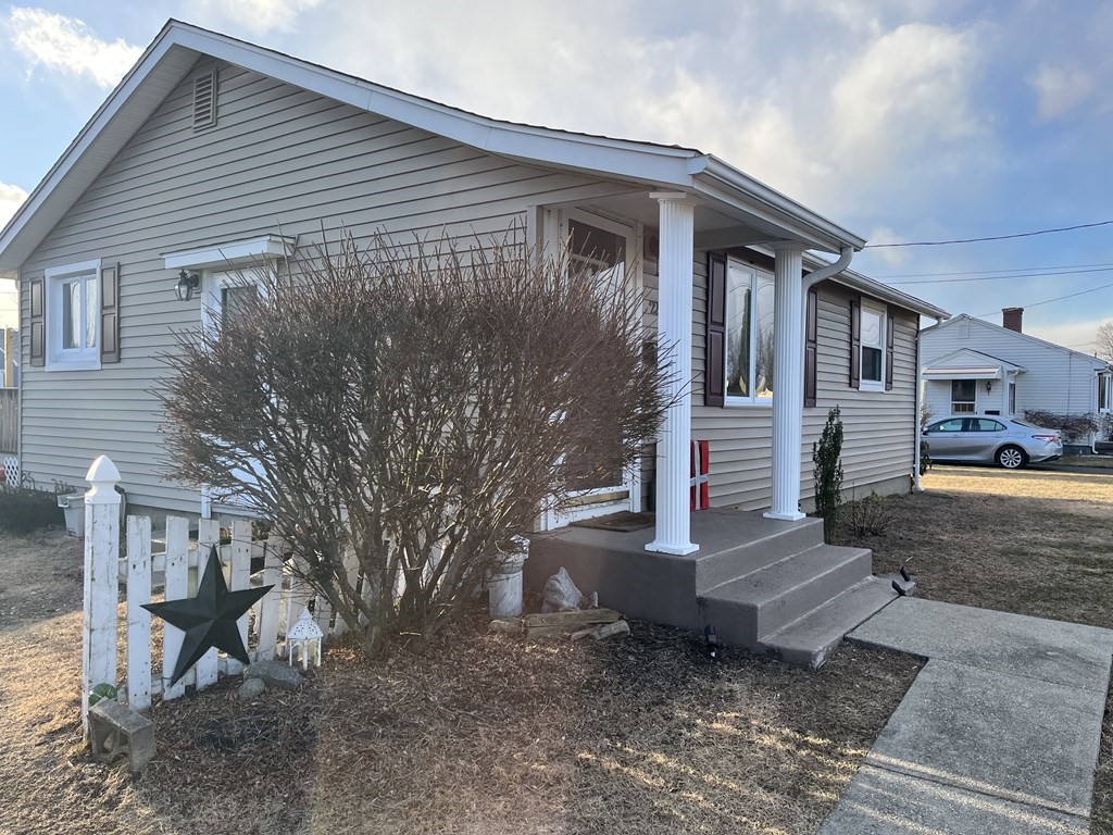 22 Rita Street Springfield, MA 01118 - Photo 2 of 3 a front view of a house with garden