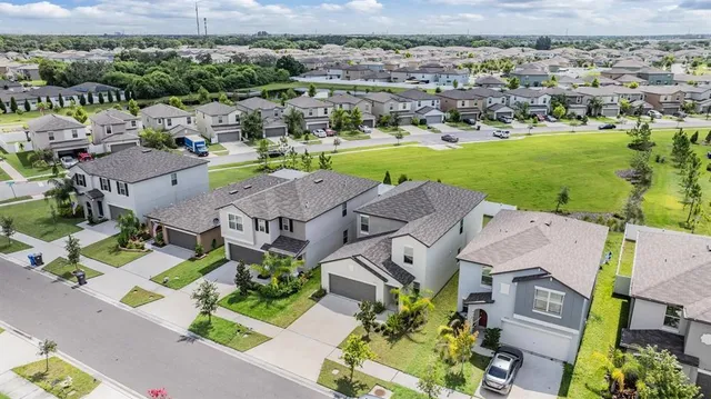an aerial view of a houses with outdoor space