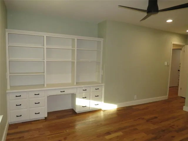 a swimming pool with outdoor seating and yard