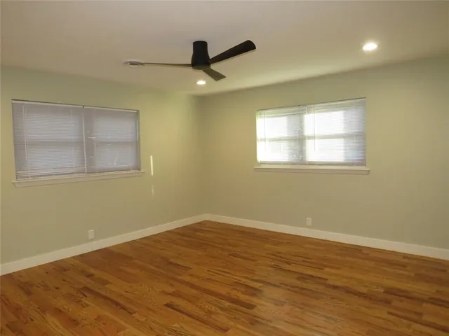 a backyard of a house with large trees