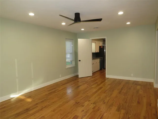 a dining room with a table and chairs