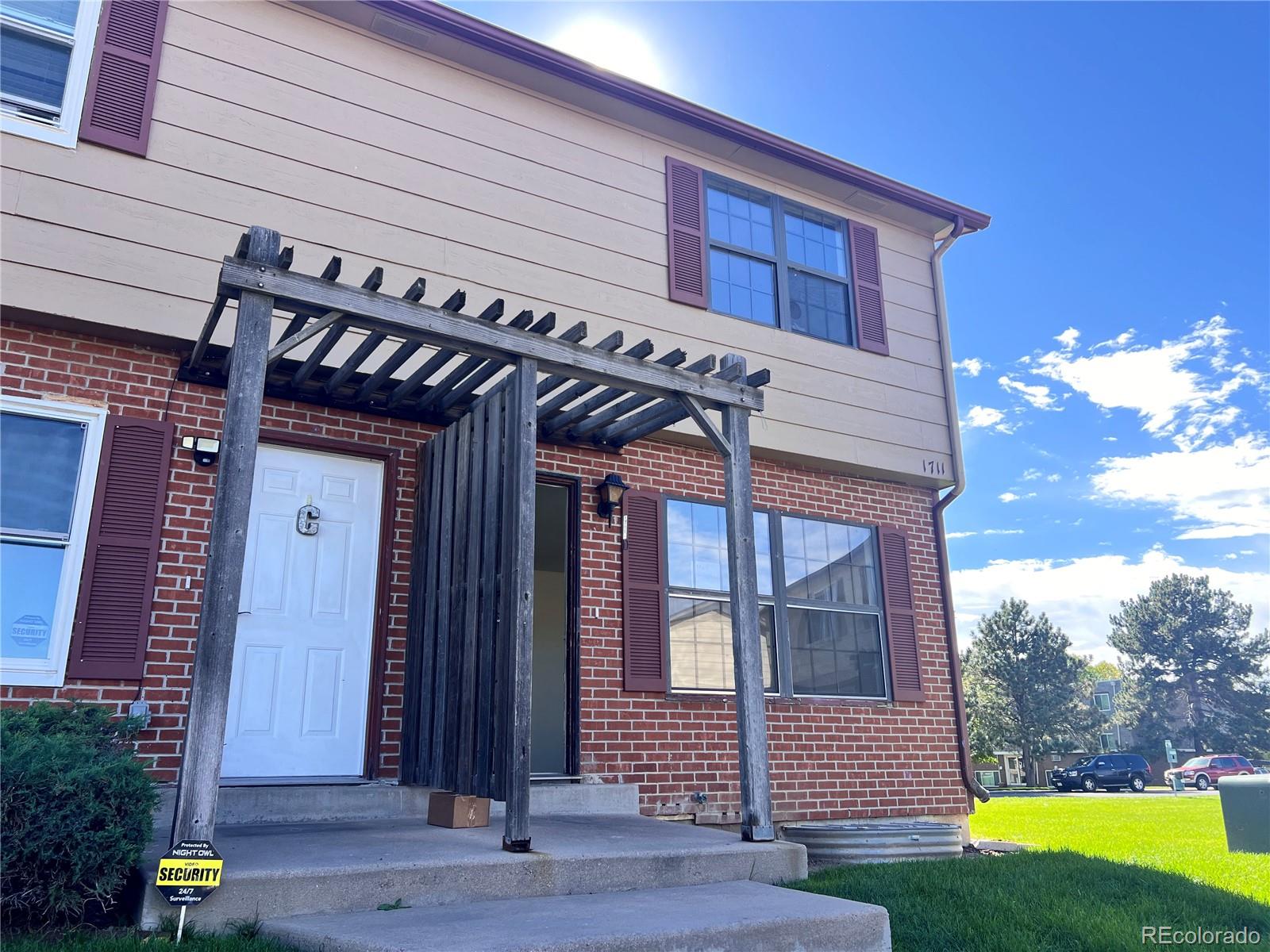 1711 Norfolk Street, Unit D Aurora, CO 80011 - Photo 3 of 16 a front view of a house
