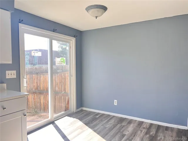a view of an empty room and window