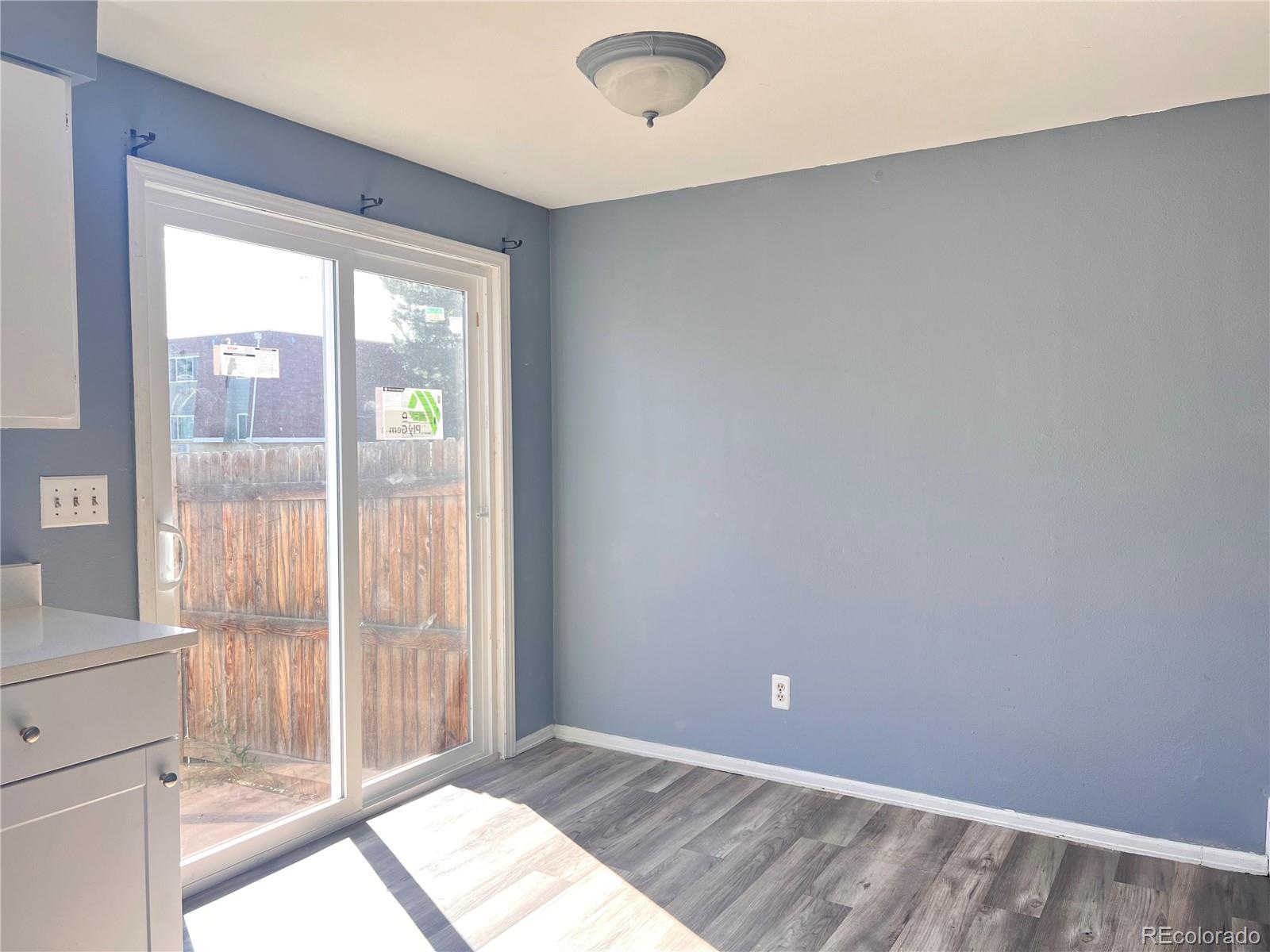 1711 Norfolk Street, Unit D Aurora, CO 80011 - Photo 10 of 16 a view of an empty room and window