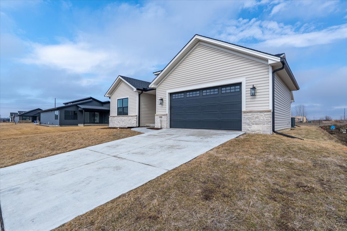 2538 Marble Road Normal, IL 61761 - Photo 4 of 27 a front view of a house with a yard and garage