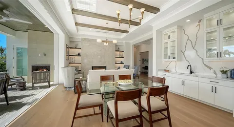 a kitchen with stainless steel appliances granite countertop a sink and stove