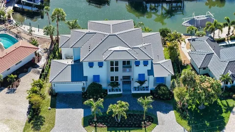 an aerial view of a house with a garden and a yard