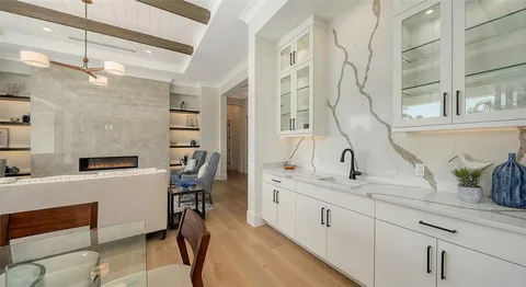 a bathroom with a double vanity sink a mirror and a shower