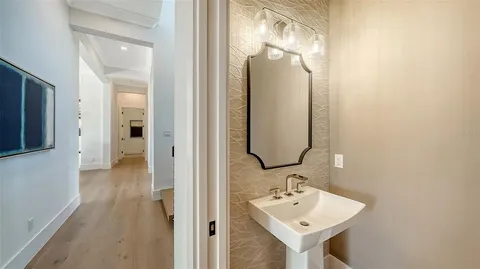 a view of a balcony with two chairs and a potted plant