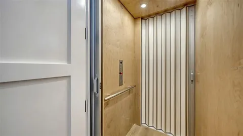 a balcony with furniture and potted plants