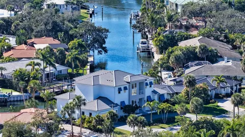 an aerial view of multiple houses with yard