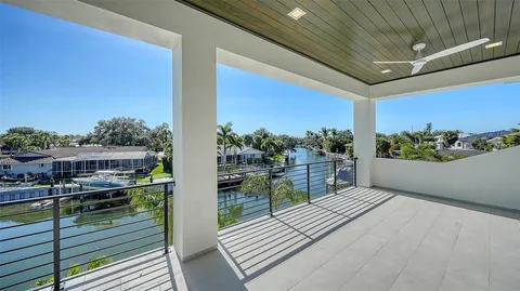an aerial view of house with yard swimming pool and outdoor seating