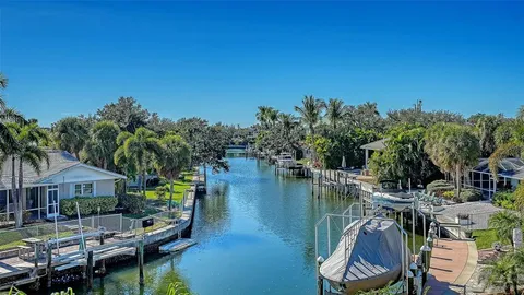 an aerial view of a house with a lake view