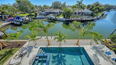 an aerial view of a house with a lake view