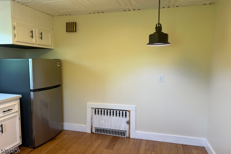 19 Spring Street Bloomfield, NJ 07003 - Photo 11 of 19 a view of a storage & utility room with a microwave