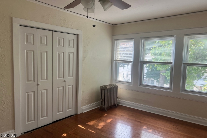 19 Spring Street Bloomfield, NJ 07003 - Photo 14 of 19 a view of an empty room with a window
