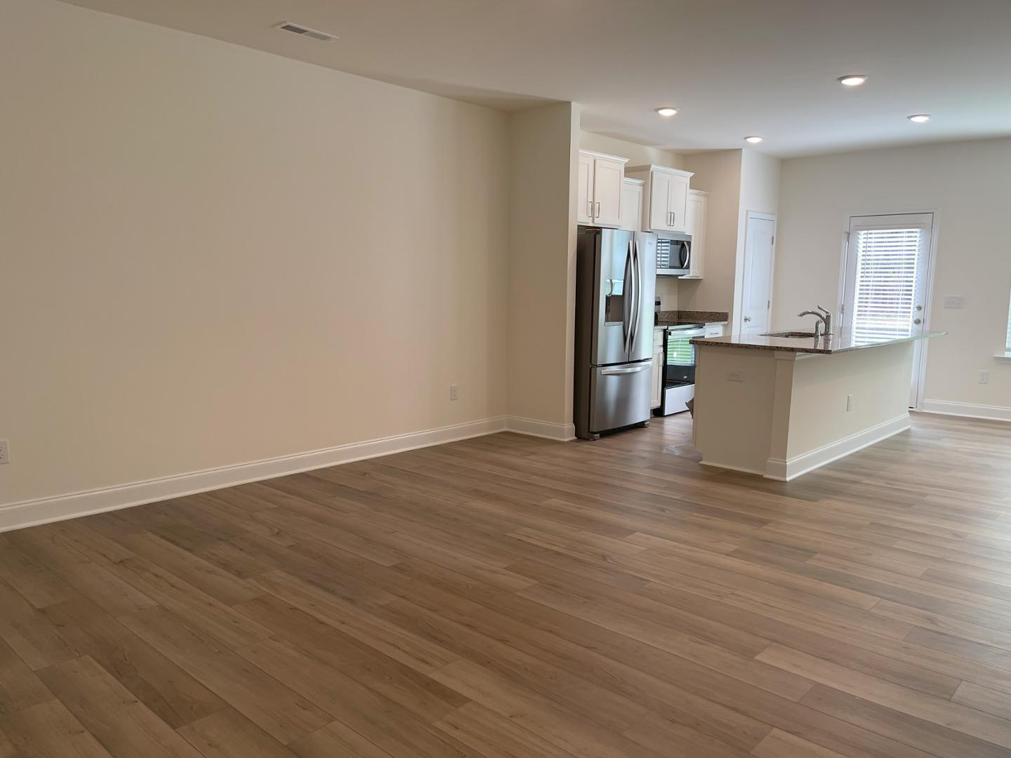 6306 Lady Eliza Lane Raleigh, NC 27610 - Photo 13 of 39 a view of kitchen with stainless steel appliances refrigerator microwave and stove