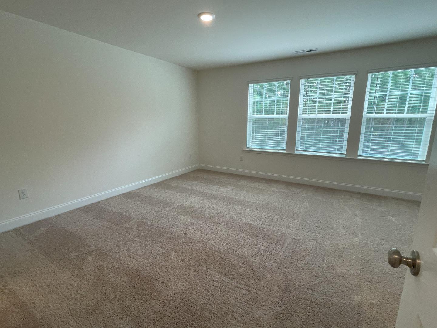 6306 Lady Eliza Lane Raleigh, NC 27610 - Photo 21 of 39 an empty room with a window