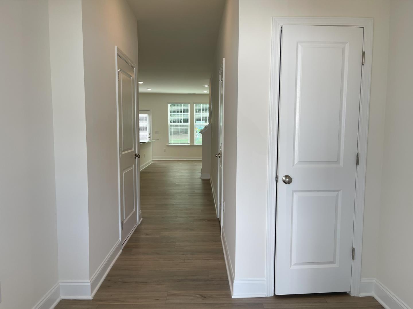 6306 Lady Eliza Lane Raleigh, NC 27610 - Photo 6 of 39 a view of a hallway with wooden floor