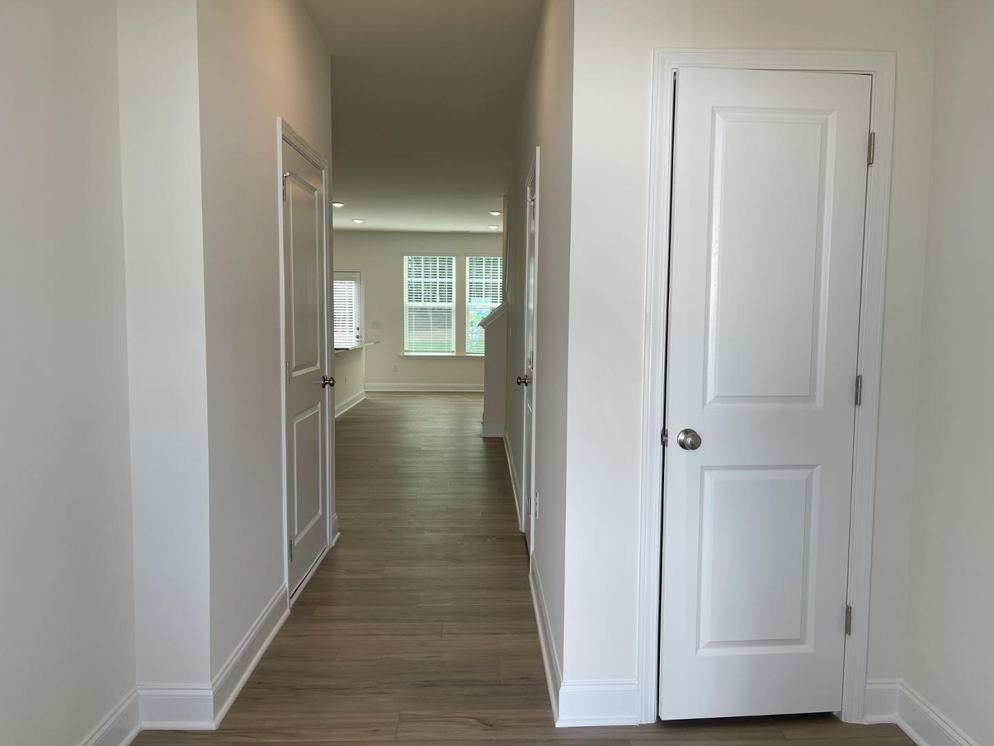 6306 Lady Eliza Lane Raleigh, NC 27610 - Photo 7 of 39 a view of a hallway with wooden floor