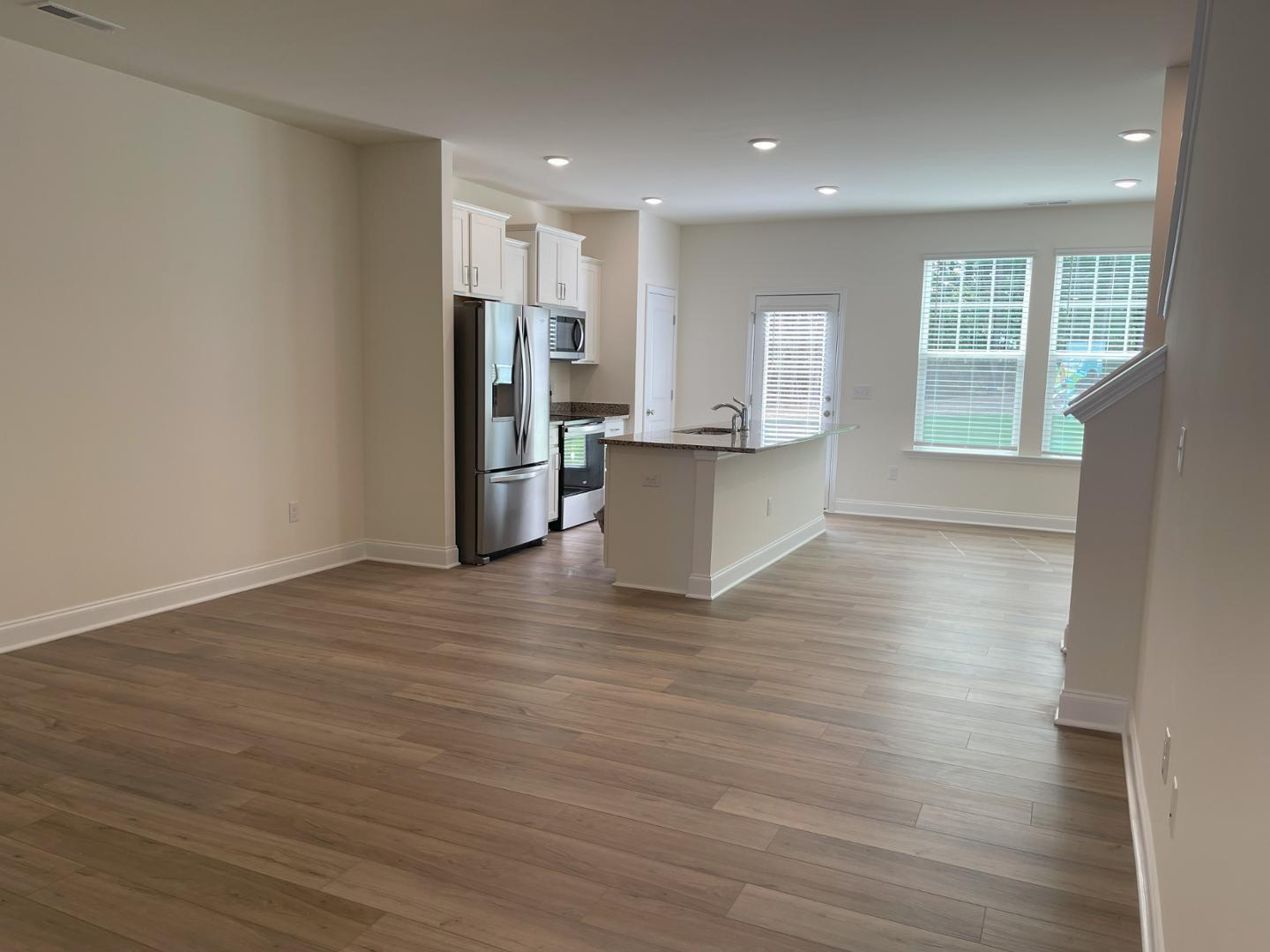 6306 Lady Eliza Lane Raleigh, NC 27610 - Photo 8 of 39 a view of kitchen with stainless steel appliances refrigerator microwave and stove