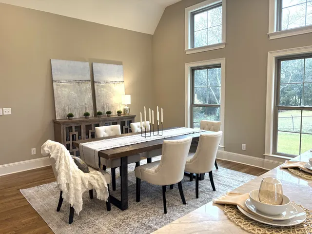 a kitchen with granite countertop a sink cabinets and stainless steel appliances