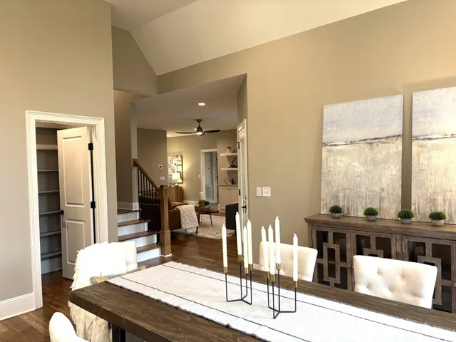 a large kitchen with stainless steel appliances a large center island and a window