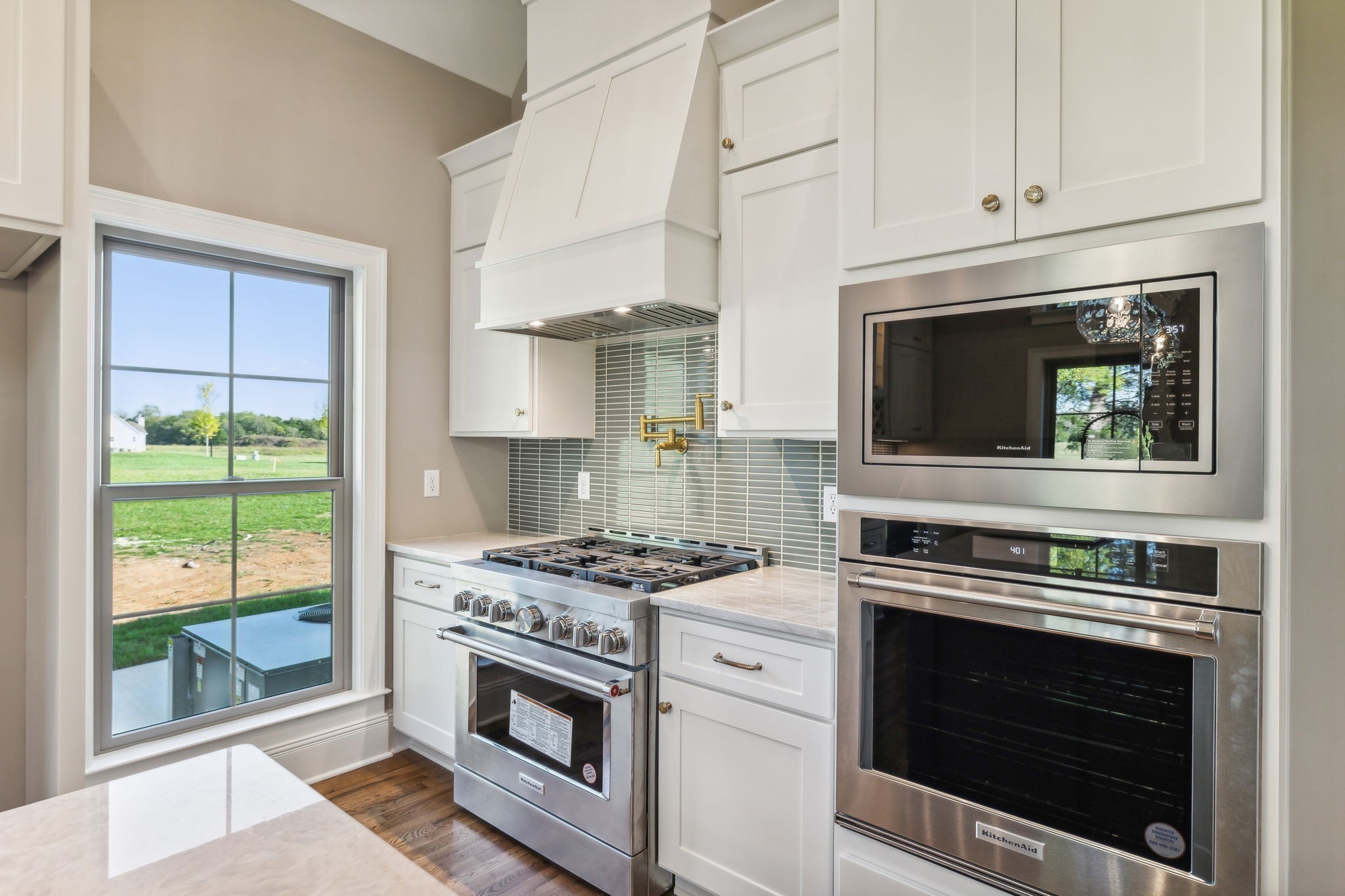 1611 Martha Washington Way Murfreesboro, TN 37130 - Photo 27 of 72 a kitchen with stainless steel appliances wooden cabinets and a stove top oven