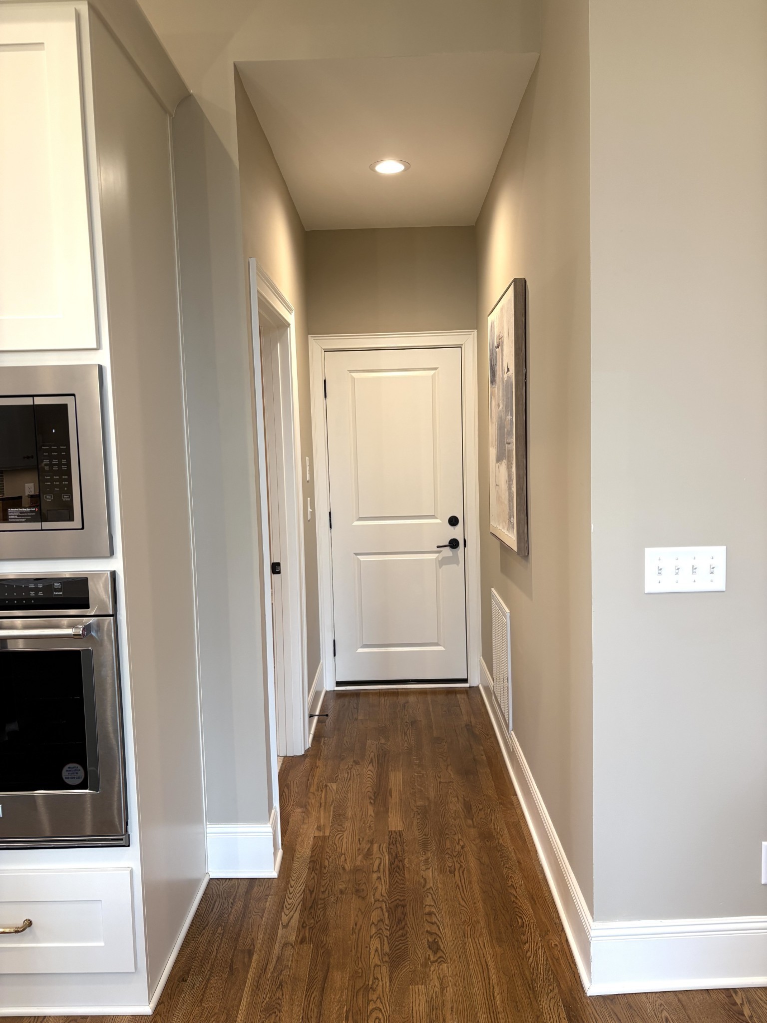 1611 Martha Washington Way Murfreesboro, TN 37130 - Photo 30 of 72 a view of a hallway with wooden floor and a kitchen