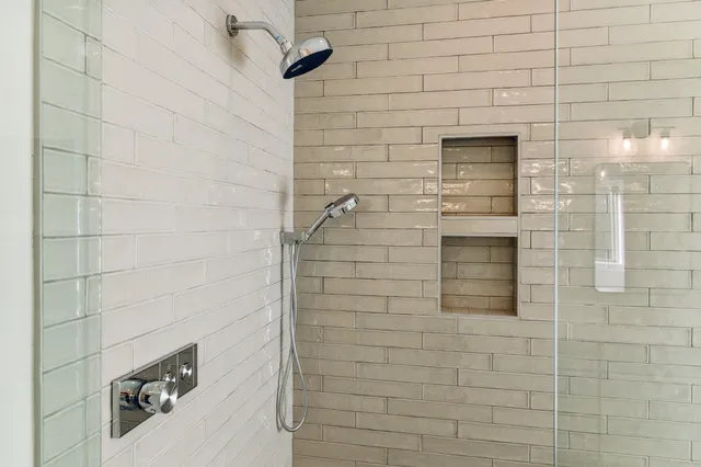 a view of a livingroom with a ceiling fan and window