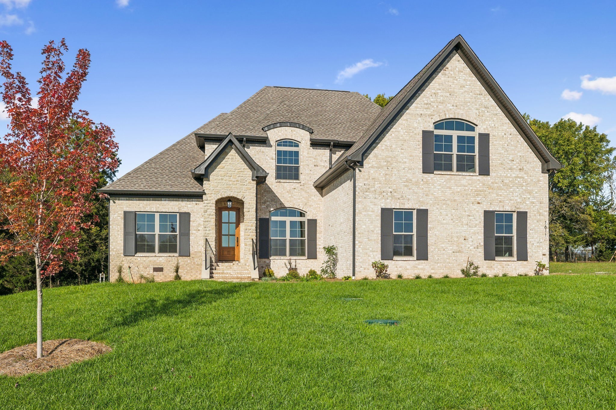 1611 Martha Washington Way Murfreesboro, TN 37130 - Photo 5 of 72 a front view of a house with a yard and trees
