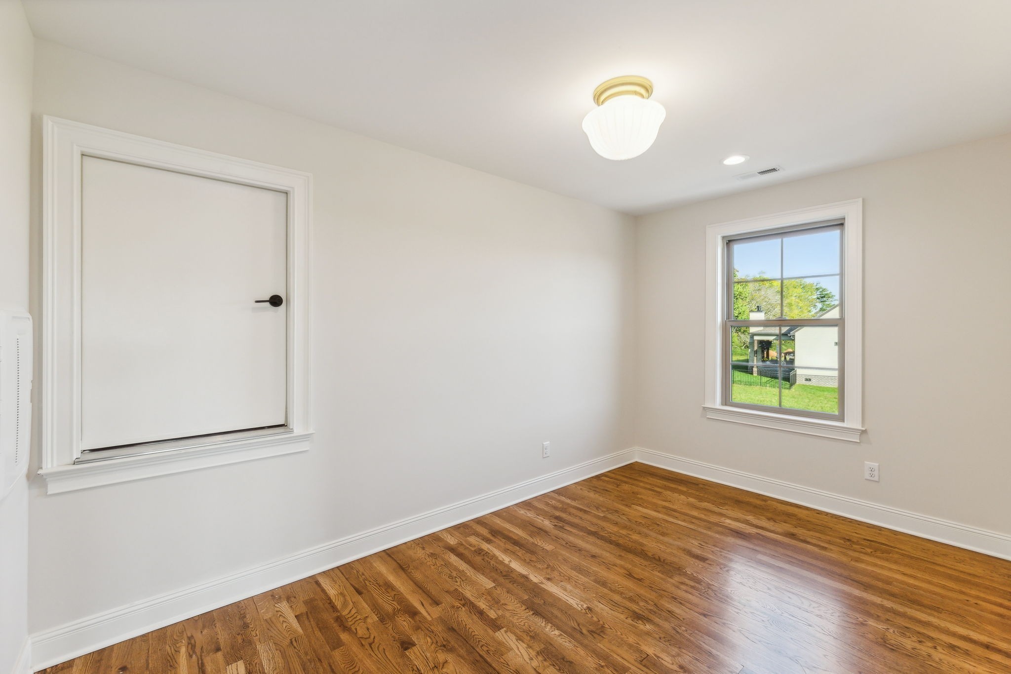 1611 Martha Washington Way Murfreesboro, TN 37130 - Photo 53 of 72 a view of an empty room with wooden floor and a window