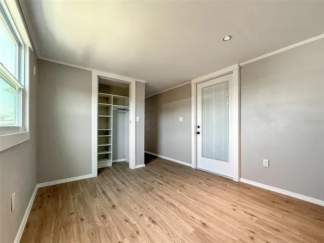 a view of an entryway with wooden floor
