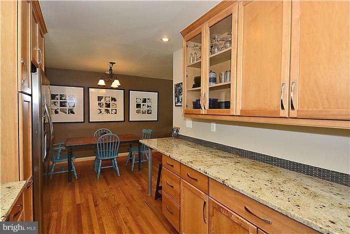 10204 Portland Road Silver Spring, MD 20901 - Photo 8 of 29 a view of a kitchen with a table and chairs