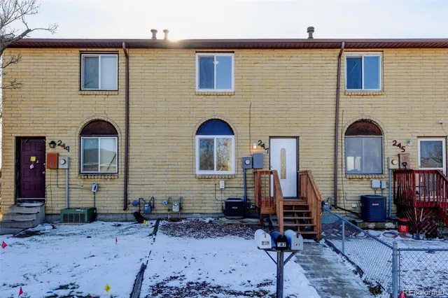 a front view of house with outdoor seating