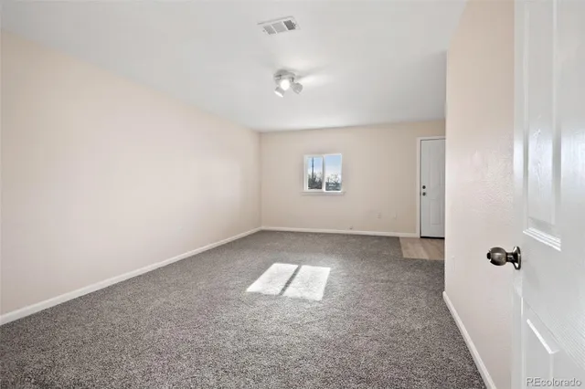 a view of an empty room and window