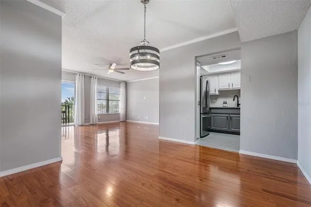 a view of a kitchen with a sink and dishwasher wooden floor