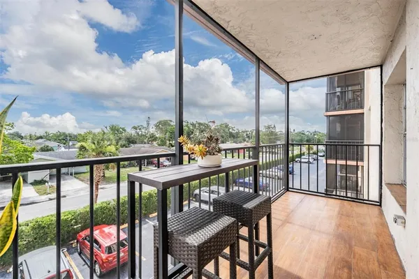 a view of a balcony with furniture