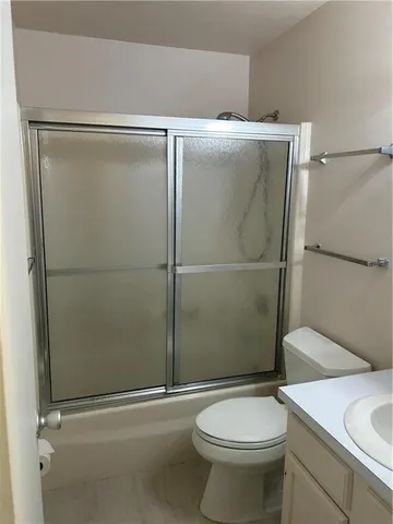 a bathroom with a toilet and a sink