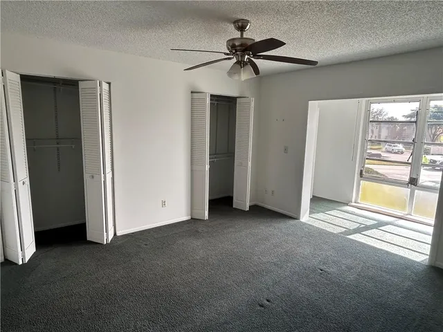 a view of empty room with windows