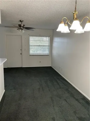 a view of a decorative ceiling fan in a room