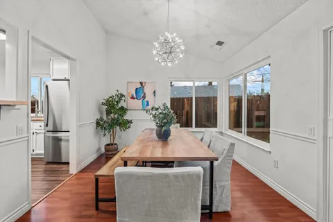 a living room with furniture fireplace and a flat screen tv
